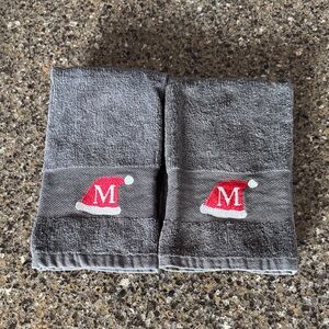 2 Gray Mini Towels with Red Santa Hat and an M Embroidered on them